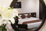 Кровать или кровати в номере Edele Hotel