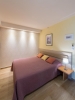 Кровать или кровати в номере Poseidon Hotel