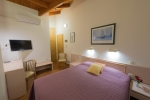 Кровать или кровати в номере Poseidon Hotel