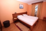 Кровать или кровати в номере Apartments Oaza 1