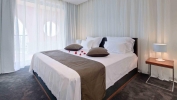 Кровать или кровати в номере Lighthouse Golf & Spa Hotel