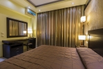Кровать или кровати в номере Gaia Palace