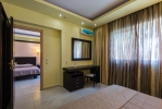 Кровать или кровати в номере Gaia Palace