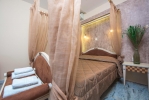 Кровать или кровати в номере Pontikonisi Hotel