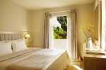 Кровать или кровати в номере Mayor La Grotta Verde Grand Resort - Adults Only