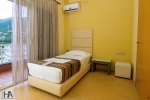 Кровать или кровати в номере Hotel Aliko