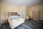 Кровать или кровати в номере Amour Holiday Resort