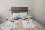 Кровать или кровати в номере Amour Holiday Resort