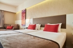 Кровать или кровати в номере Ramada Plaza Thraki