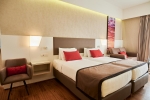 Кровать или кровати в номере Ramada Plaza Thraki