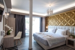 Кровать или кровати в номере Garden Palace Hotel