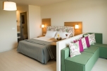 Кровать или кровати в номере ALEA Hotel & Suites
