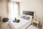 Кровать или кровати в номере Eviana Beach