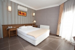 Кровать или кровати в номере Yelken Mandalinci Spa&Wellness Hotel
