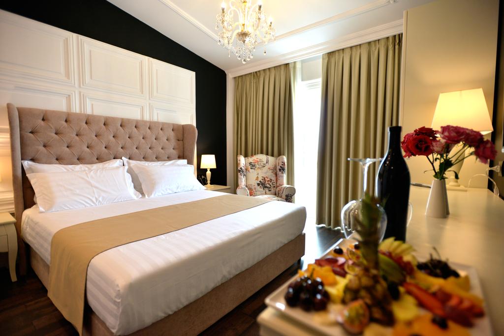 Отель Кровать или кровати в номере Hotel Flower & SPA