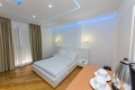 Кровать или кровати в номере ALER Luxury Vlore