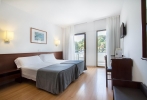 Кровать или кровати в номере Hotel Gran Garbi & AquasPlash