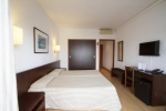 Кровать или кровати в номере Hotel Gran Garbi & AquasPlash