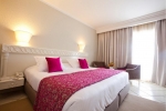 Кровать или кровати в номере El Mouradi Palm Marina