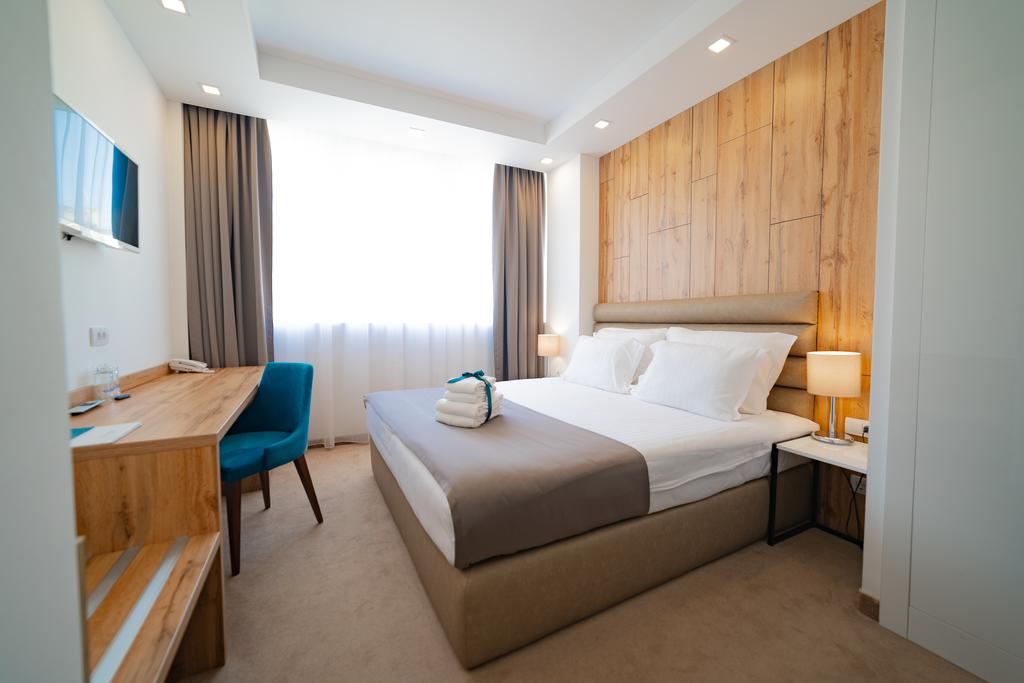 Кровать или кровати в номере MARK Hotel 