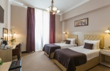 Кровать или кровати в номере Belgrade City Hotel 