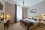 Кровать или кровати в номере Belgrade City Hotel 