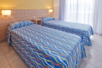Кровать или кровати в номере Voramar Cambrils 