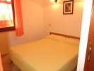 Кровать или кровати в номере Appartamenti Costa Rei 