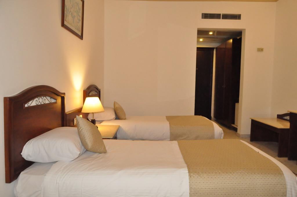 Кровать или кровати в номере Roma Host Way Hotel & Aqua Park 