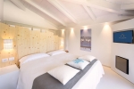 Кровать или кровати в номере Chia Laguna - Hotel Baia