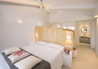 Кровать или кровати в номере Chia Laguna - Hotel Baia