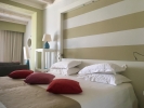 Кровать или кровати в номере Chia Laguna - Hotel Laguna