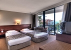 Кровать или кровати в номере Golden Lotus Hotel