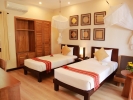 Кровать или кровати в номере Bamboo Village Beach Resort & Spa