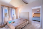 Кровать или кровати в номере CHC Athina Palace Resort & Spa