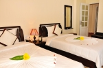 Кровать или кровати в номере Swiss Village Resort & Spa