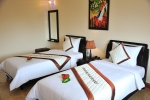 Кровать или кровати в номере Swiss Village Resort & Spa