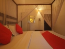 Кровать или кровати в номере OYO 37483 Ocean View -Goan Beach House