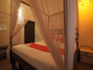Кровать или кровати в номере OYO 37483 Ocean View -Goan Beach House