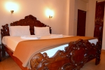 Кровать или кровати в номере Mayflower Beach Resort