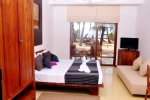 Кровать или кровати в номере Pandanus Beach Resort & Spa