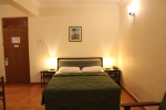 Кровать или кровати в номере Palmarinha Resort & Suites