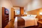 Кровать или кровати в номере Ibis Bali Kuta