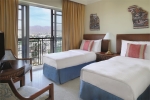 Кровать или кровати в номере Mövenpick Resort & Residences Aqaba