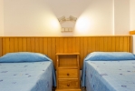 Кровать или кровати в номере Aparthotel Ferrer Isabel 