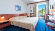 Кровать или кровати в номере Hotel Komodor