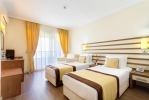 Кровать или кровати в номере Hotel Akbulut & Spa