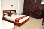 Кровать или кровати в номере Lavendish Beach Resort