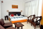 Кровать или кровати в номере Lavendish Beach Resort
