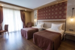 Кровать или кровати в номере Gural Premier Tekirova